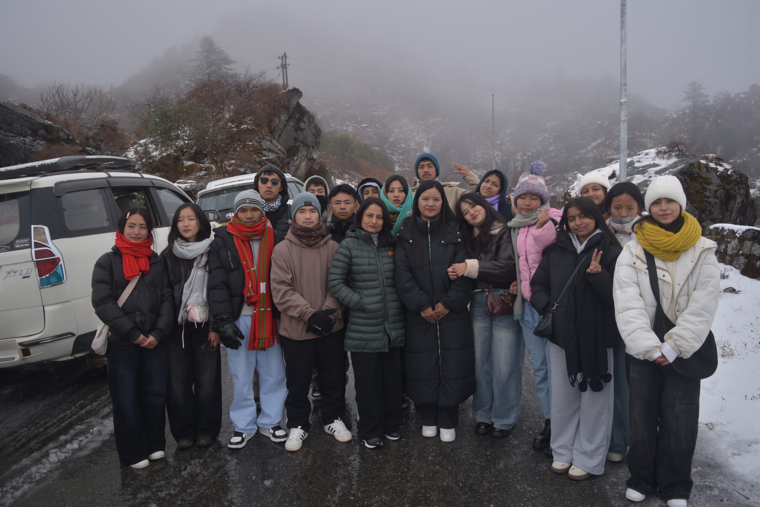 "Smiling students and teachers of PM Shri SSS Dentam pose together with Indrakeel Tours guides on their successful 2-day Zuluk and Gnathang Valley school tour in Sikkim."